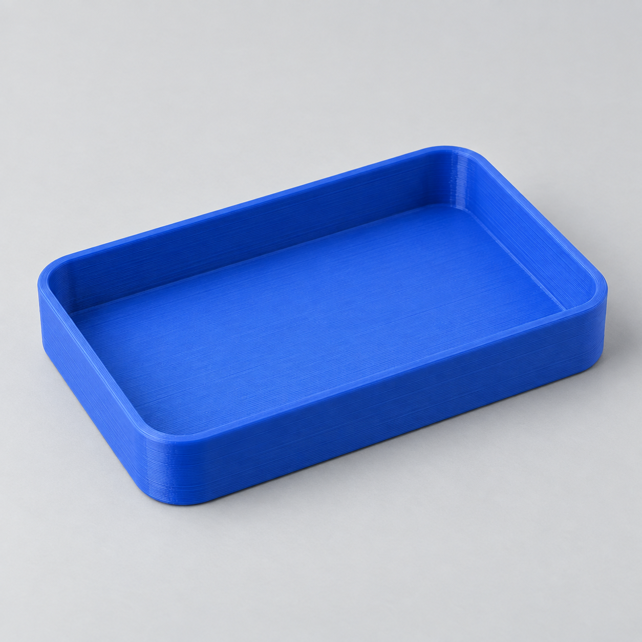 Illustrative shallow blue 3D printed desk tray